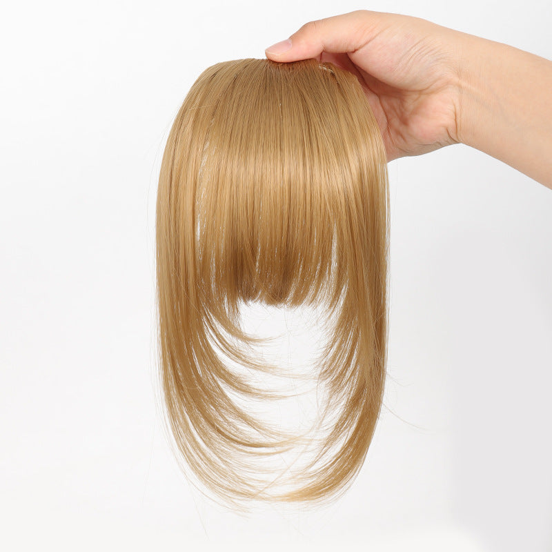 Fake bangs hairpiece for the top of the head